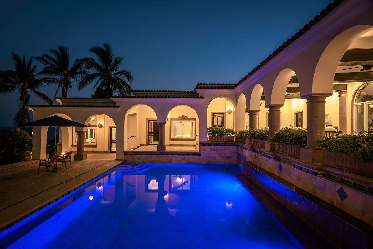 Courtyard and pool at dusk at Villa Tortuga in Punta Bella, Los Cabos.