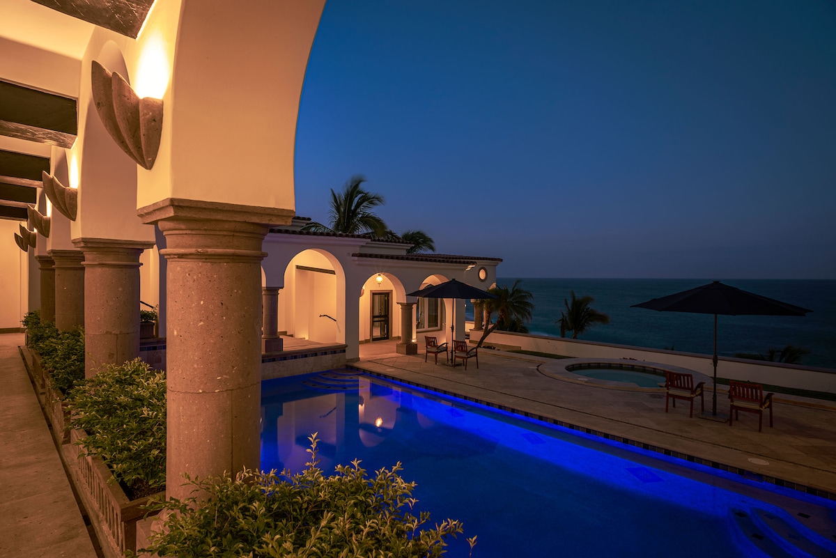 Arched terrace illuminated at dusk at Villa Tortuga, Punta Bella, Los Cabos.