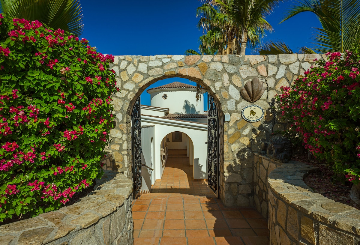 Arched entrance of Villa Tortuga illuminated at dusk, Punta Bella, Los Cabos.
