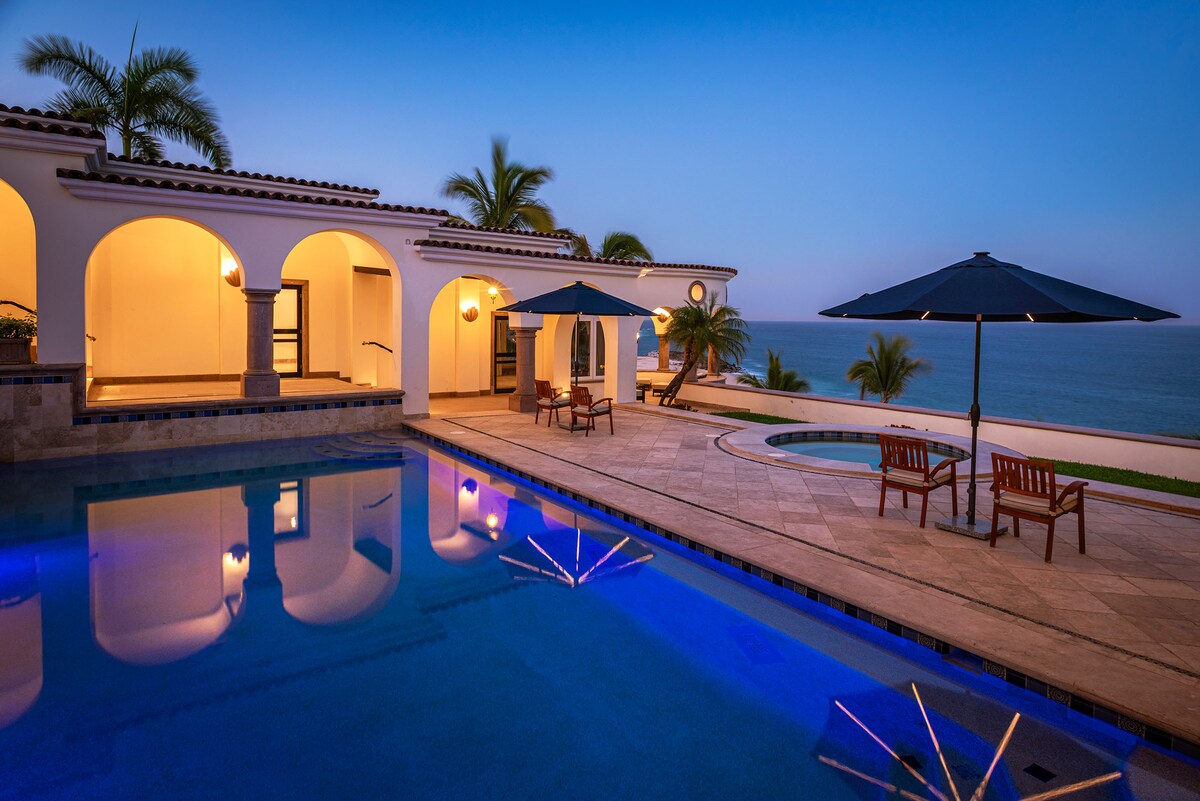 Illuminated private pool at dusk at Villa Tortuga in Punta Bella, Los Cabos.
