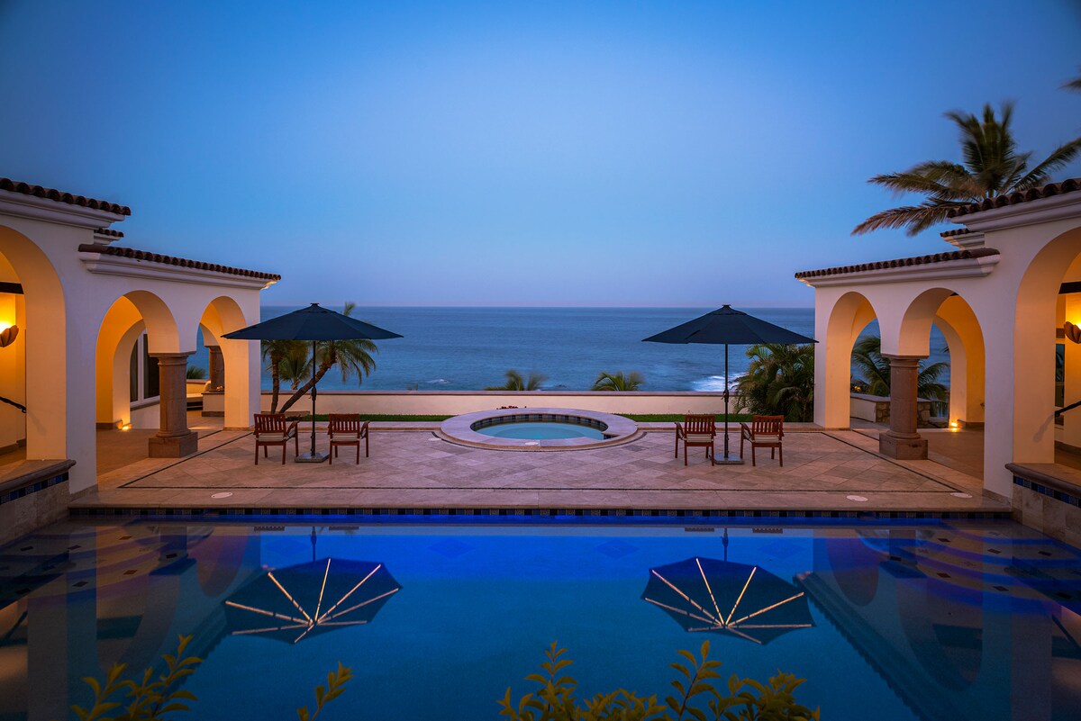 Private pool and terrace at dusk with ocean views at Villa Tortuga, Punta Bella, Los Cabos.