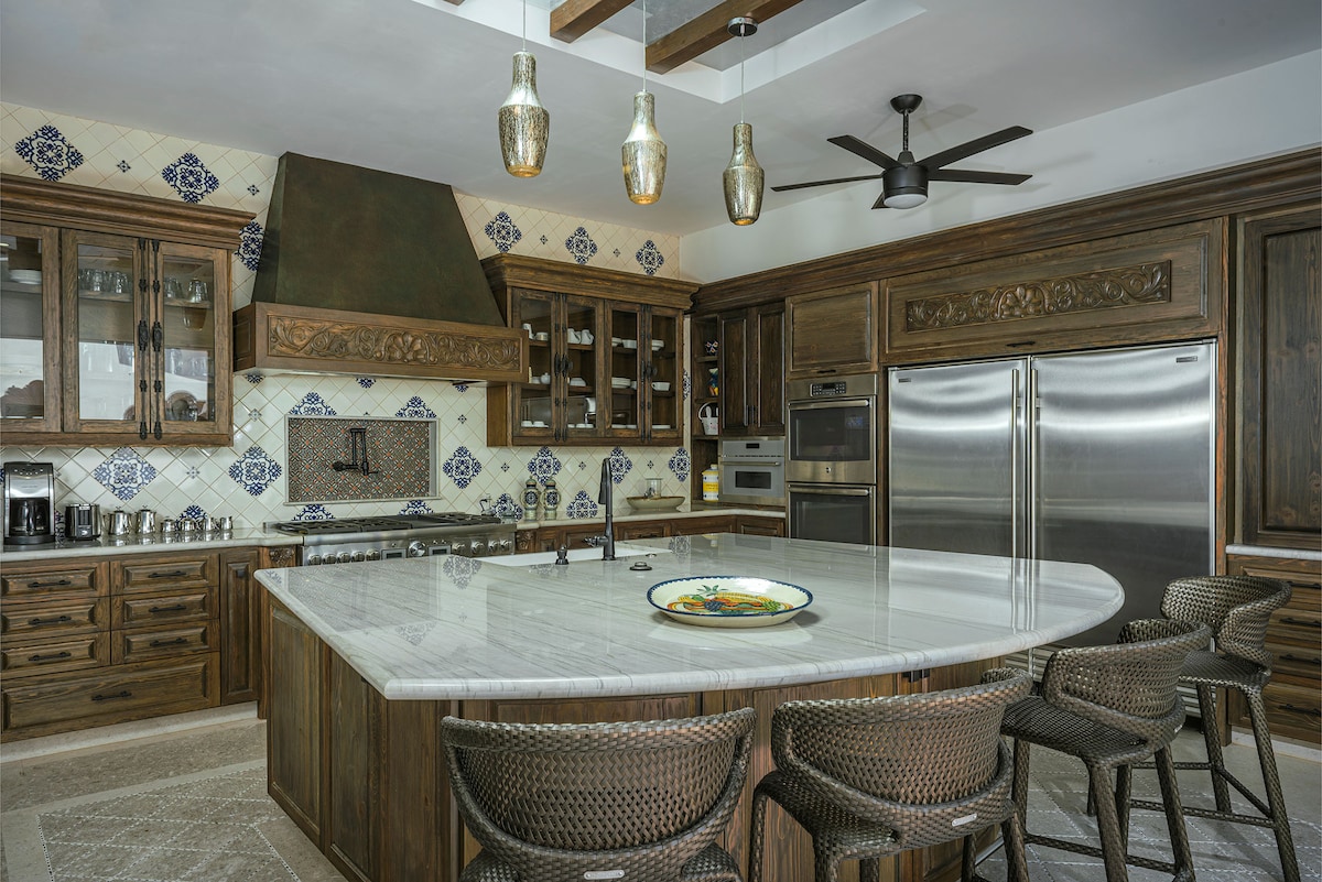 Dining area and kitchen at Villa Tortuga in Punta Bella, Los Cabos.