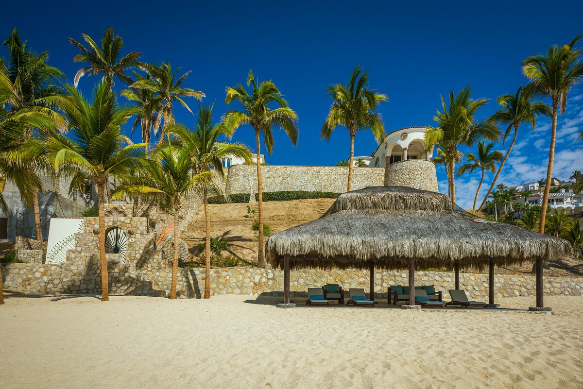 Beach and palms near Villa Tortuga, a beachfront villa in Punta Bella, Los Cabos.