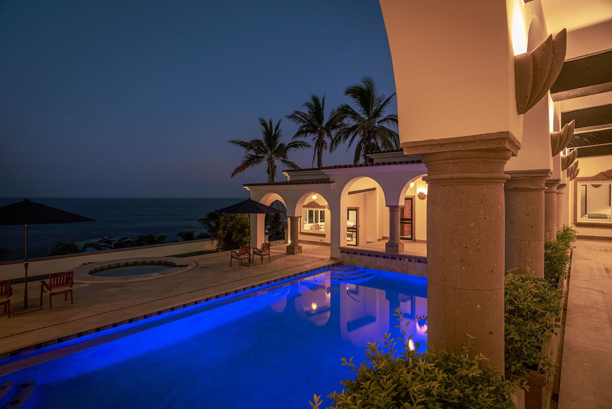 Private pool and villa illuminated at dusk at Villa Tortuga, Punta Bella, Los Cabos.