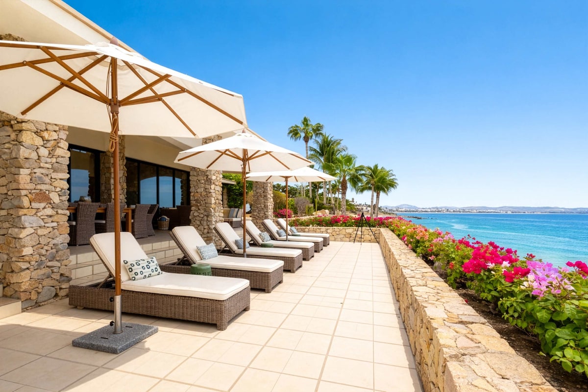 Shaded sun loungers and umbrellas for the perfect lazy afternoon by the sea.
