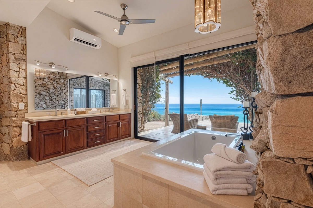 Bathroom with plush towels, rain shower and spa-like finishes.