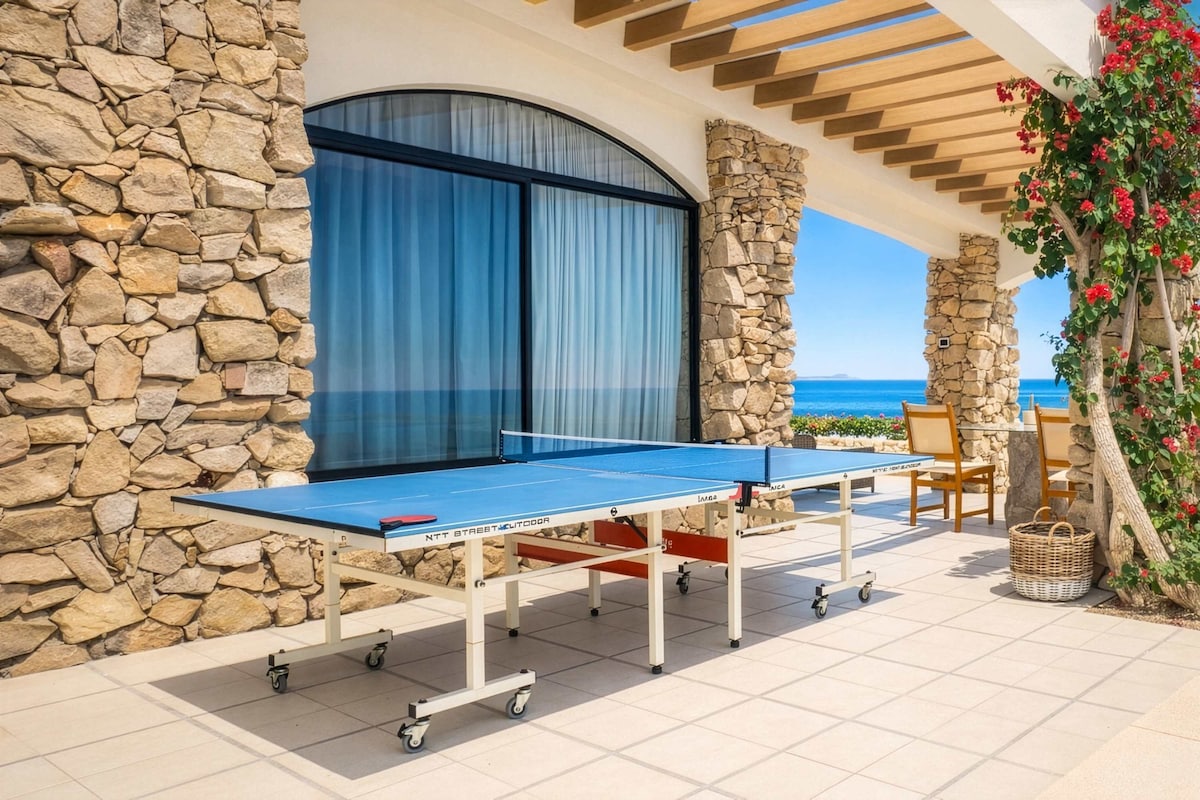 Covered patio with ping pong table — fun for the whole vacation crew.