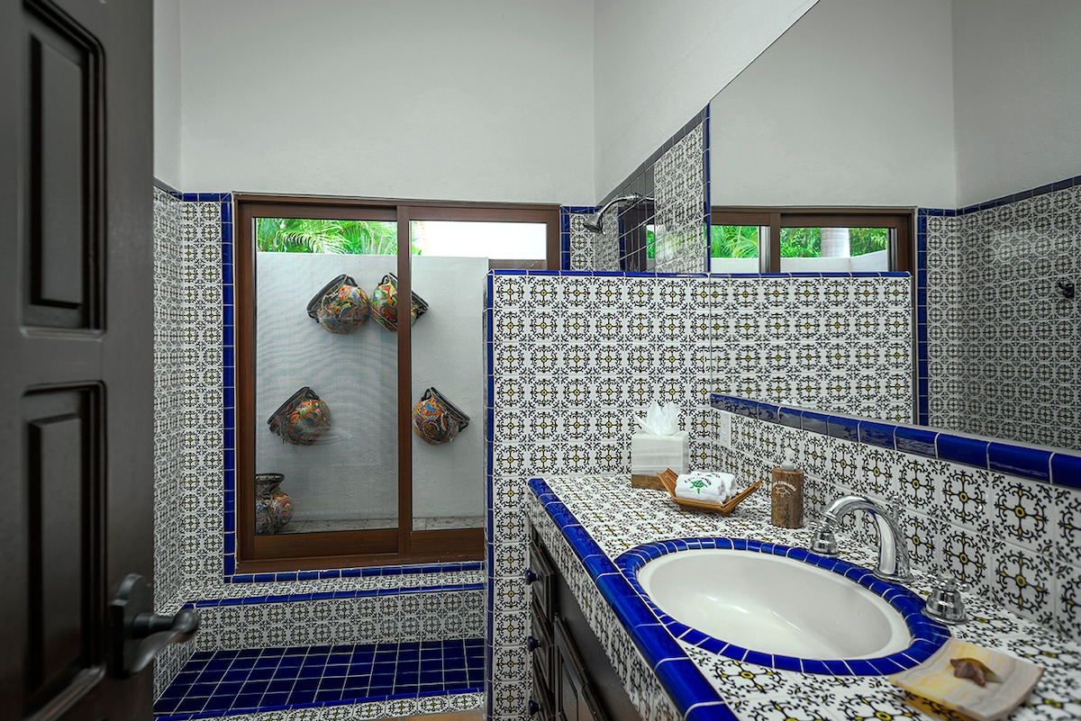 En-suite bathroom with blue talavera tile, vanity and walk-in shower at Casa Edwards, Palmilla, Los Cabos