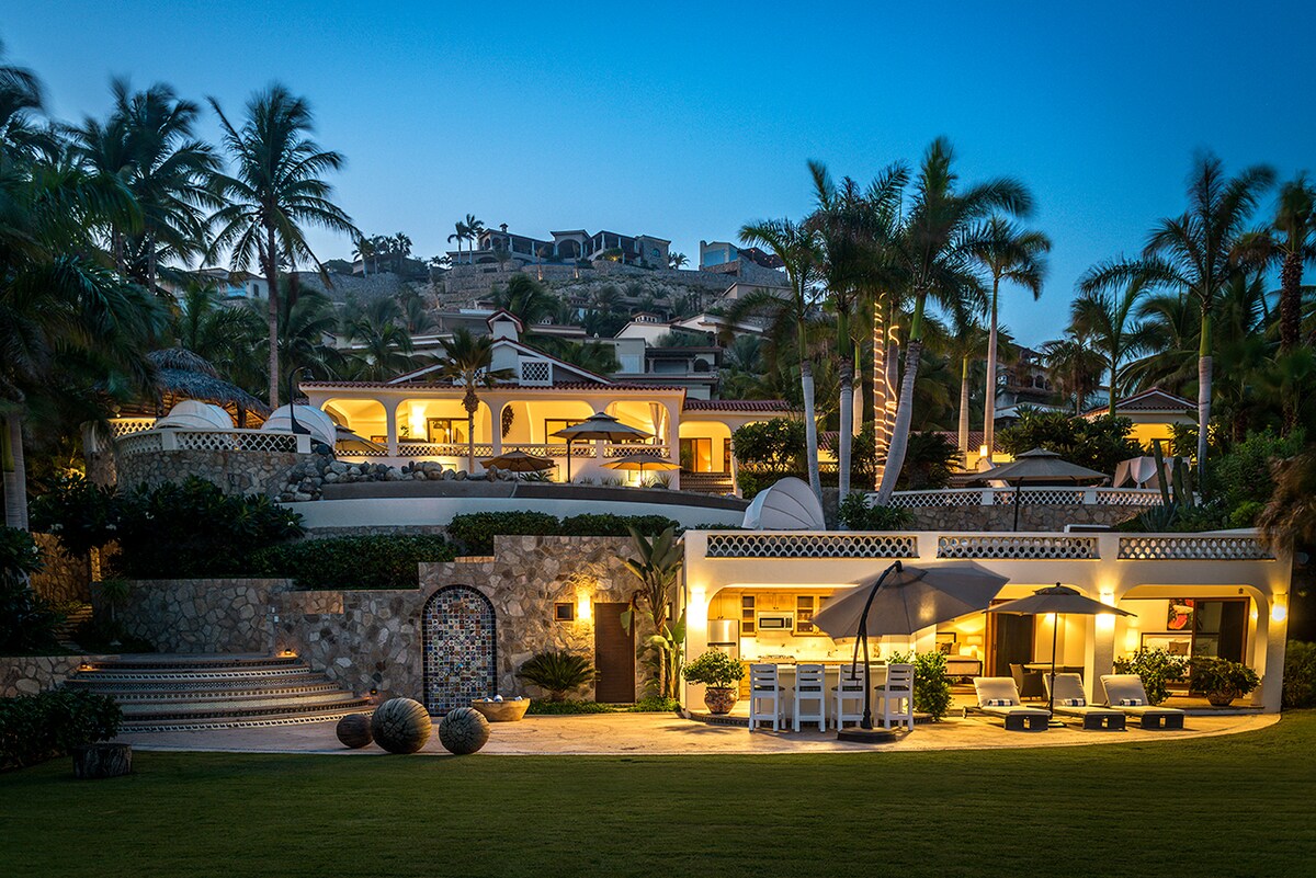 Casa Edwards illuminated at night seen from the oceanfront lawn in Palmilla, Los Cabos