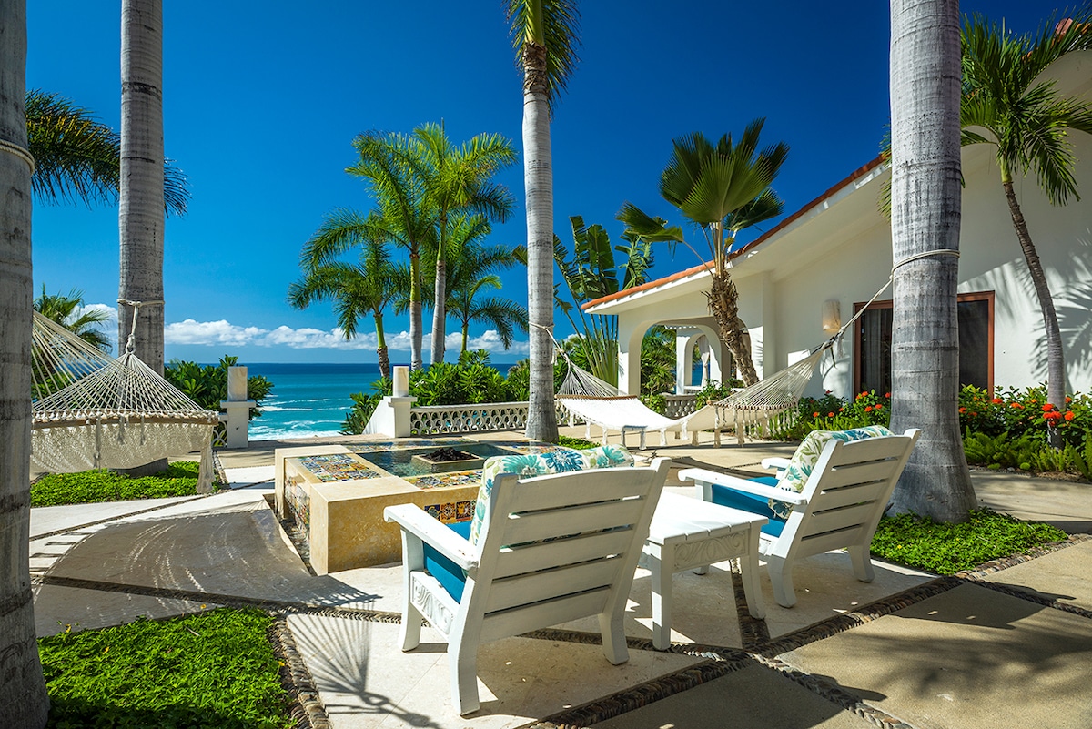 Hammocks and fire table on the oceanfront terrace at Casa Edwards, beachfront villa in Palmilla