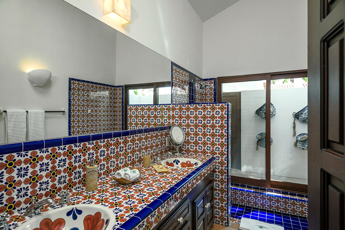 En-suite bathroom with hand-painted talavera tile and double vanity at Casa Edwards, Palmilla, Los Cabos
