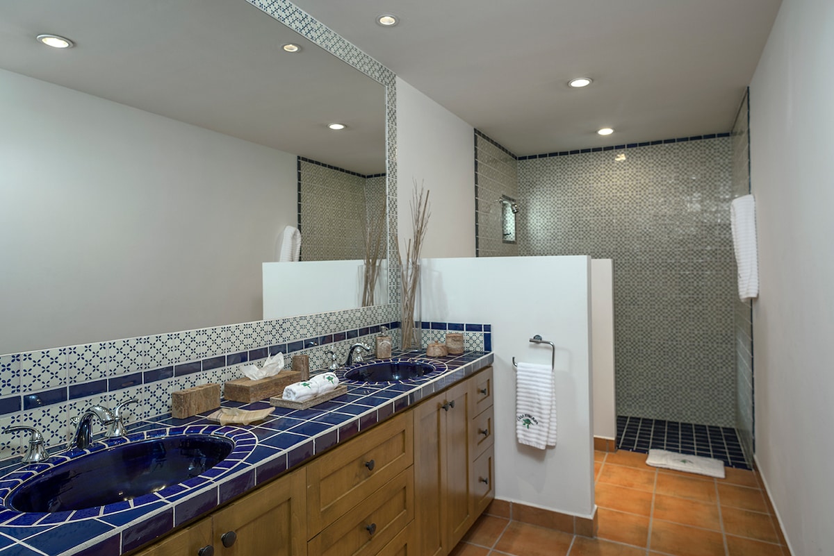 En-suite bathroom with walk-in rain shower and talavera vanity at Casa Edwards, Palmilla