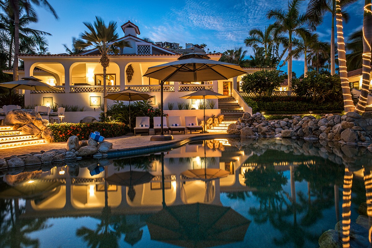 The pool and main house lit at night at Casa Edwards, beachfront luxury villa in Palmilla, Los Cabos